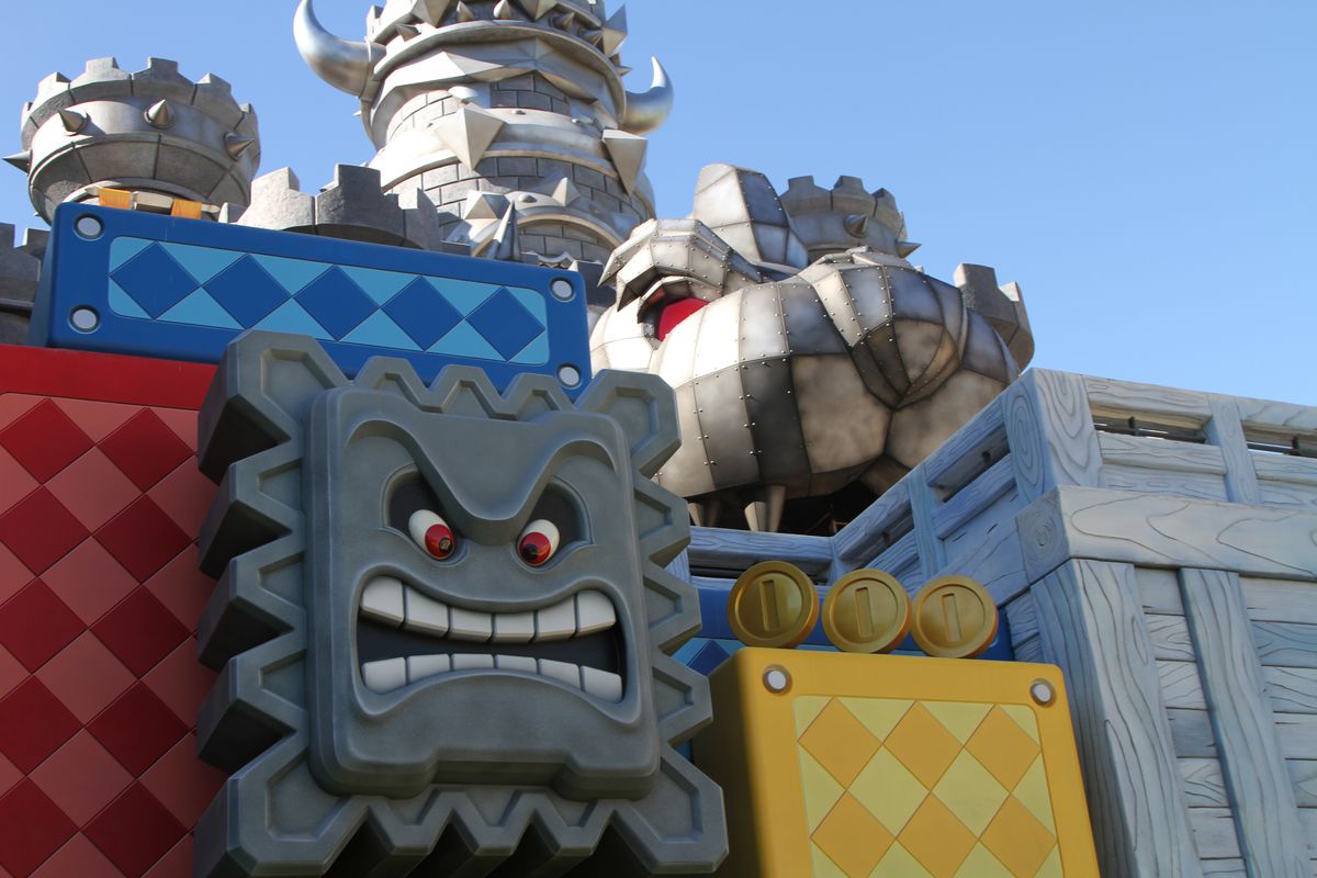 A section of Super Nintendo World, with a giant Thwomp in front of Bowser’s Castle.